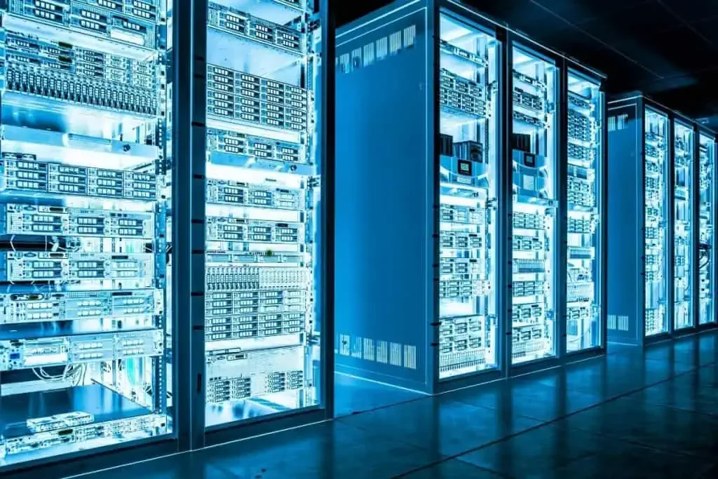 IT support technician working on server equipment in a modern data centre